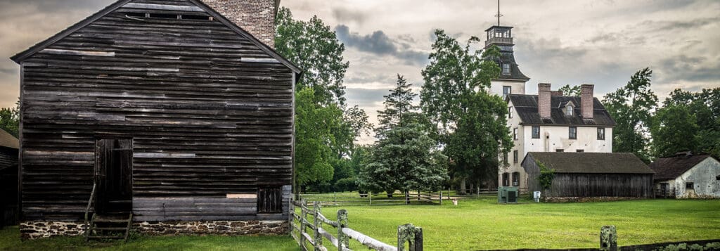 Batsto village, historic buildings on open land with lots of fall foliage.

